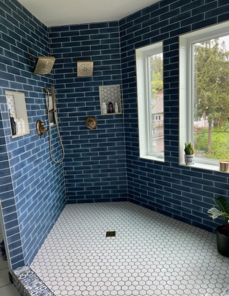 blue shower tile with white tile shower floor