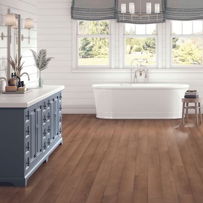 luxury vinyl plank floors in a rustic bathroom design for Hillsboro OR