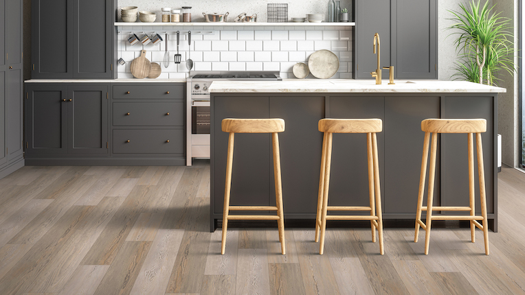 luxury vinyl plank flooring in a modern kitchen with dark cabinets and kitchen island